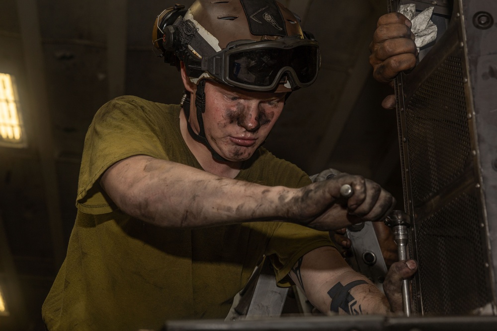 U.S. Marine Maintains a MV-22B Aboard USS Iwo Jima (LHD 7)