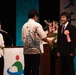 Ichiro Umehara accepts city-level award on behalf of Camp Courtney from Uruma City