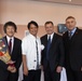 Ichiro Umehara accepts city-level award on behalf of Camp Courtney from Uruma City