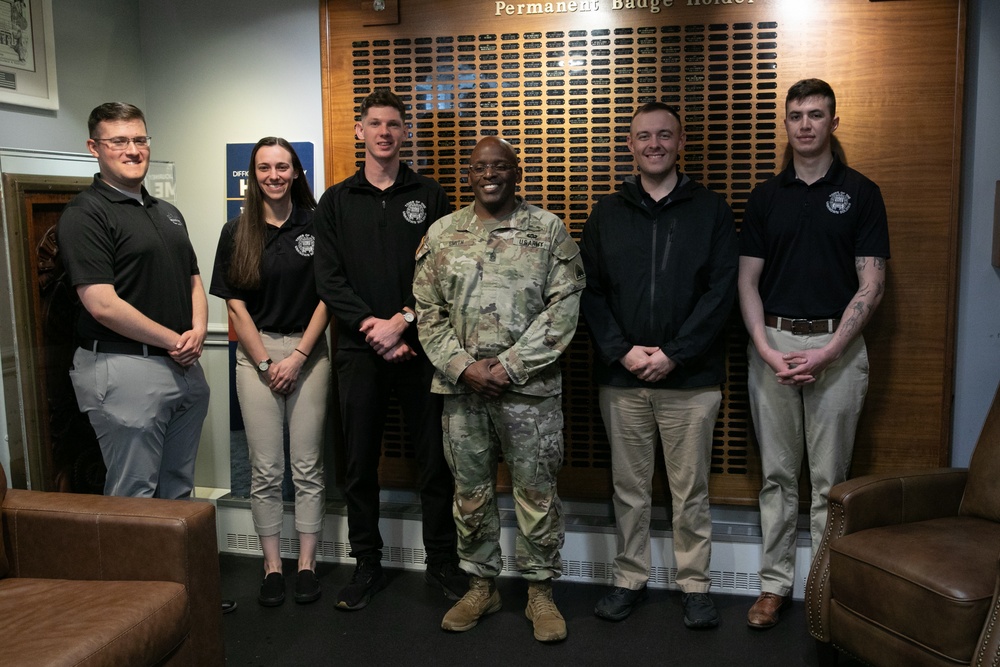 Guards at Arlington National Cemetery are presented with coins by Command Sergeant Major of the DC National Guard