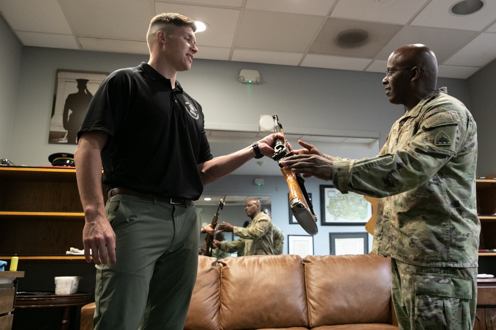 Guards at Arlington National Cemetery are presented with coins by Command Sergeant Major of the DC National Guard
