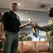 Guards at Arlington National Cemetery are presented with coins by Command Sergeant Major of the DC National Guard