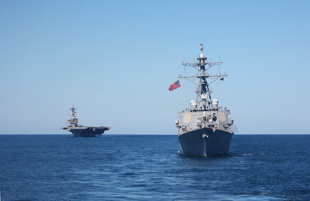 USS George H.W. Bush (CVN 77) and USS Donald Cook (DDG 75) Steaming in Formation for the Titans of the Sea Presidential Review
