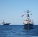 USS George H.W. Bush (CVN 77) and USS Donald Cook (DDG 75) Steaming in Formation for the Titans of the Sea Presidential Review