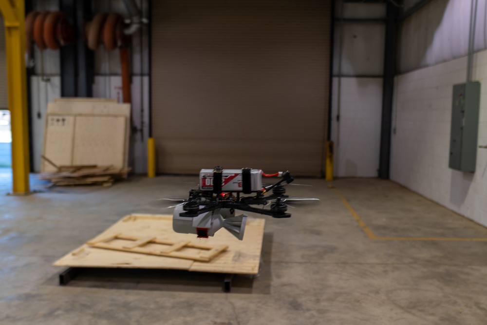 ABE 101 hovering over plywood at manufacturing warehouse