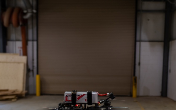 ABE 101 hovering over plywood at manufacturing warehouse