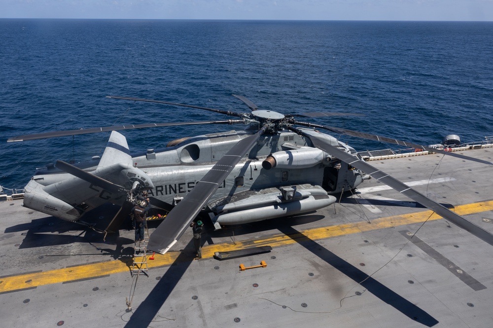 U.S. Marines Conduct Maintenance on a CH-53