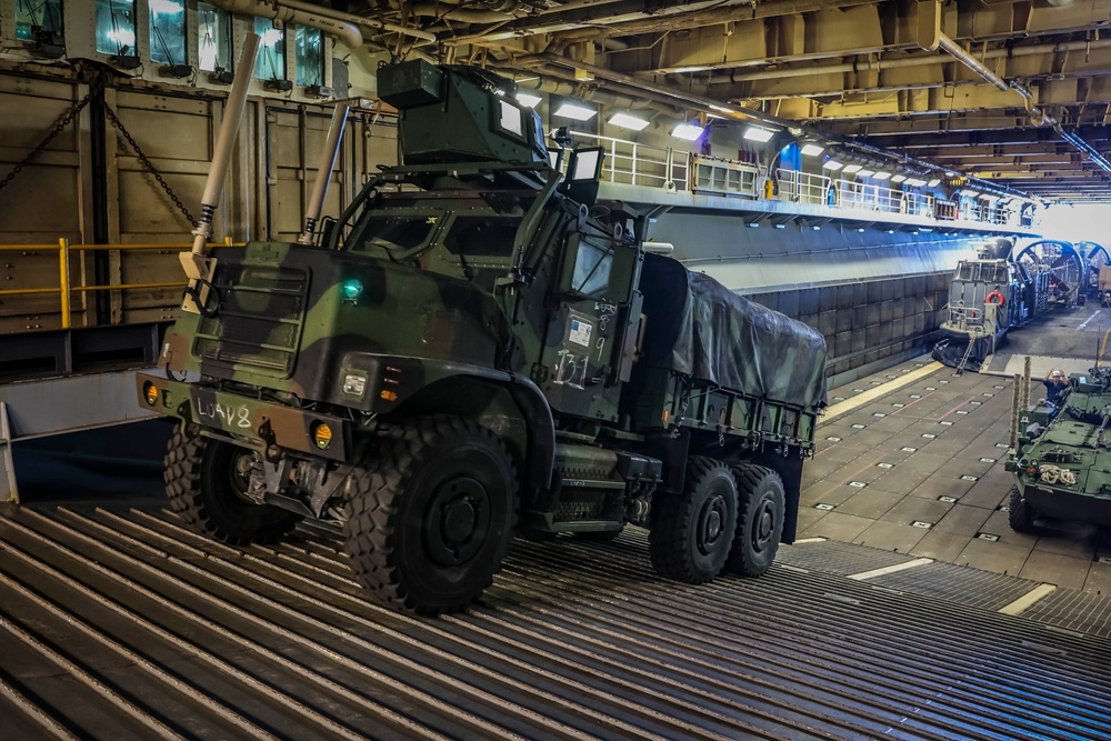 U.S. Marine Moves Vehicles aboard USS Iwo Jima