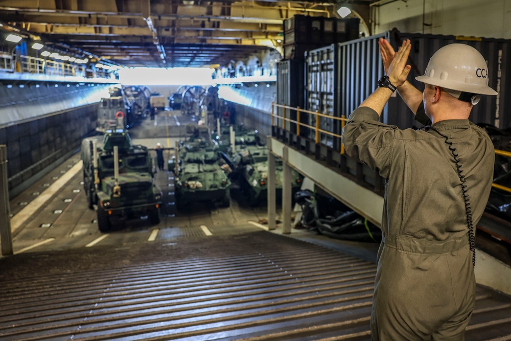 U.S. Marine Moves Vehicles aboard USS Iwo Jima
