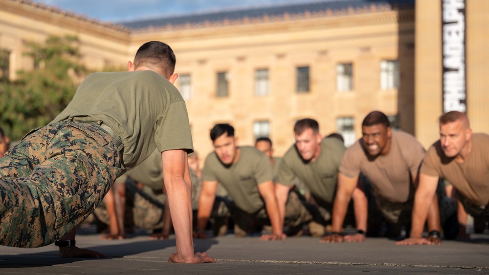 Sailors and Marines run the Rocky Steps during Navy and Marine Corps 250