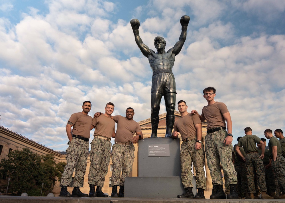 Sailors and Marines run the Rocky Steps during Navy and Marine Corps 250