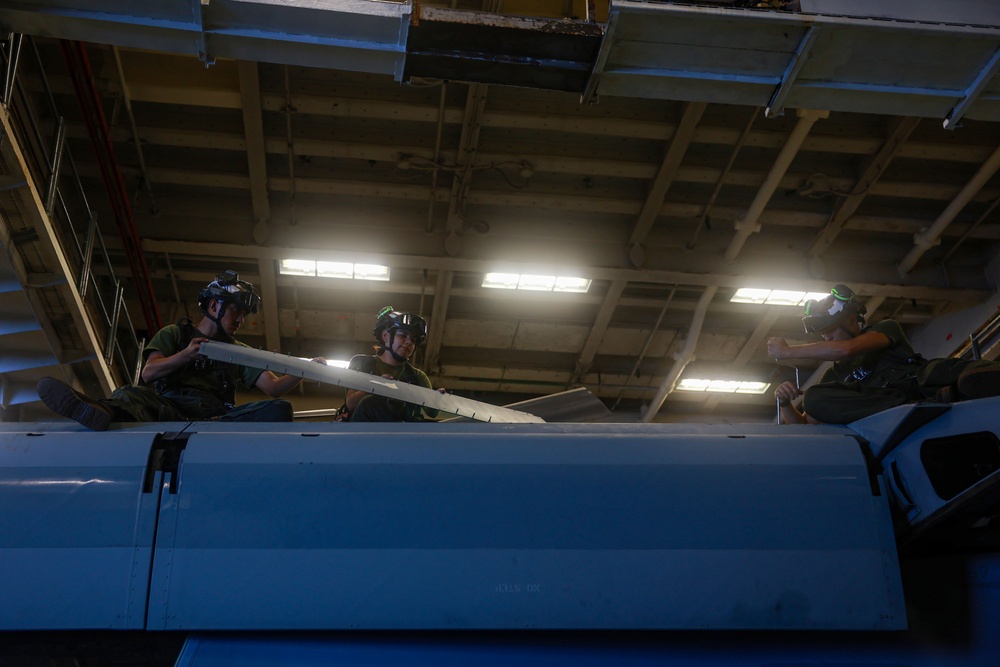 U.S. Marines Conduct Aircraft Maintenance Aboard USS Iwo Jima
