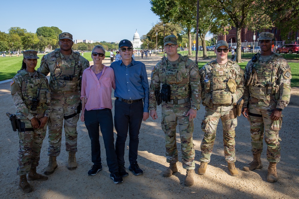 Mississippi National Guard Troops take a photo with civilians