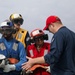 Sailors aboard the USS John Finn conduct a crash and salvage drill in the Philippine Sea