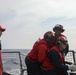 Sailors aboard the USS John Finn conduct a crash and salvage drill in the Philippine Sea