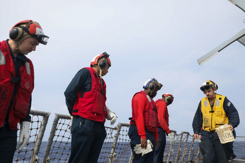 Sailors aboard the USS John Finn conduct a crash and salvage drill in the Philippine Sea