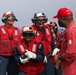 Sailors aboard the USS John Finn conduct a crash and salvage drill in the Philippine Sea