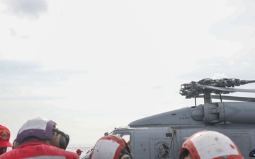 Sailors aboard the USS John Finn conduct a crash and salvage drill in the Philippine Sea