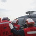 Sailors aboard the USS John Finn conduct a crash and salvage drill in the Philippine Sea