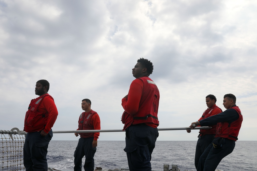 Sailors aboard the USS John Finn conduct flight quarters in the Philippine Sea