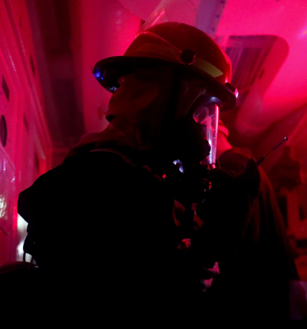 Sailors aboard the USS John Finn conduct a damage control drill in the Java Sea