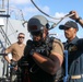 Sailors aboard the USS John Finn conduct a visit, board, search, and seizure drill in the Philippine Sea