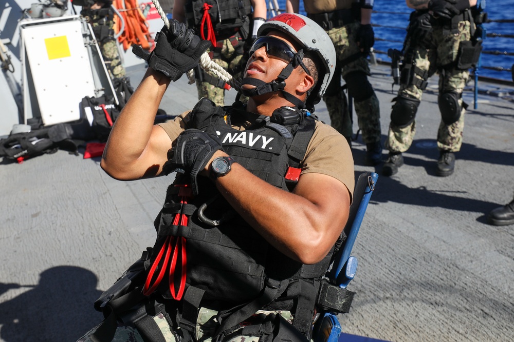 Sailors aboard the USS John Finn conduct a visit, board, search, and seizure drill in the Philippine Sea