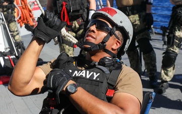 Sailors aboard the USS John Finn conduct a visit, board, search, and seizure drill in the Philippine Sea