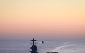 Italian Navy Offshore Patrol Vessel ITS Paolo Thaon di Revel (P430) Sails with USS Gerald R. Ford (CVN 78)