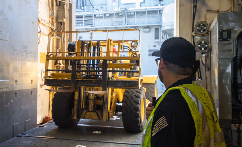 USS America (LHA 6) Conducts Store Onload