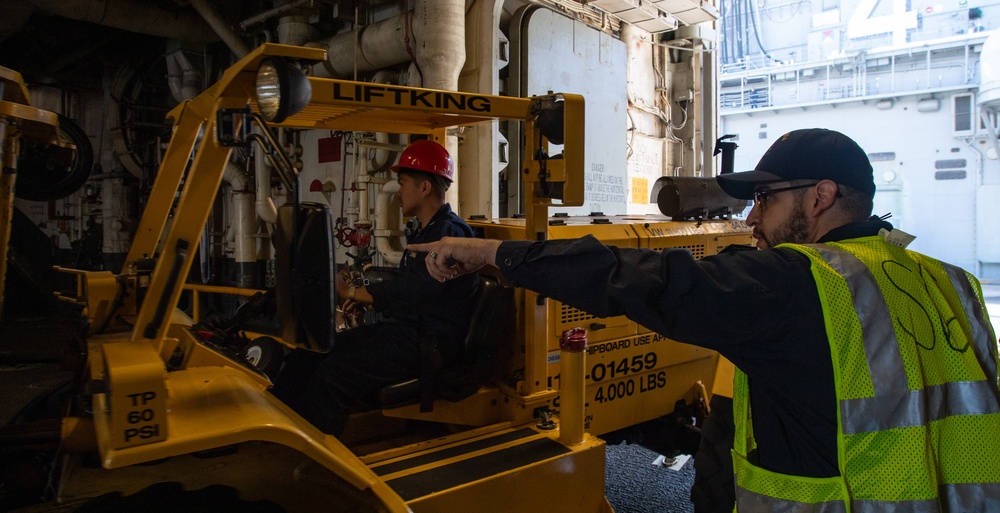 USS America (LHA 6) Conducts Store Onload