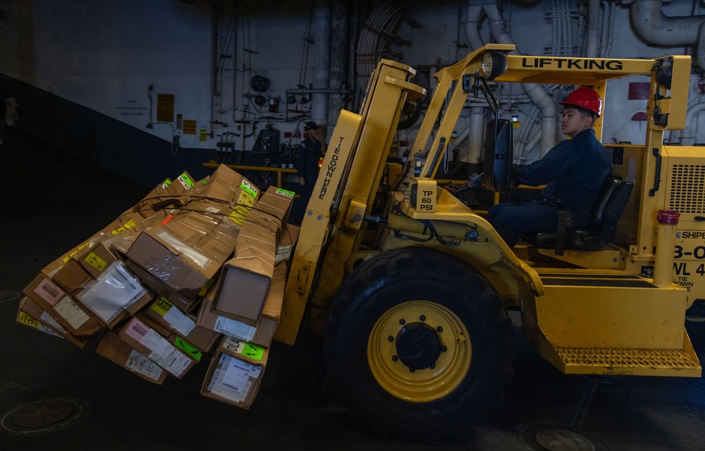 USS America (LHA 6) Conducts Store Onload