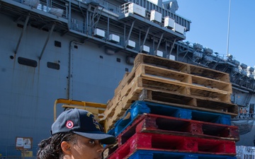 USS America (LHA 6) Conducts Store Onload