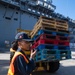USS America (LHA 6) Conducts Store Onload