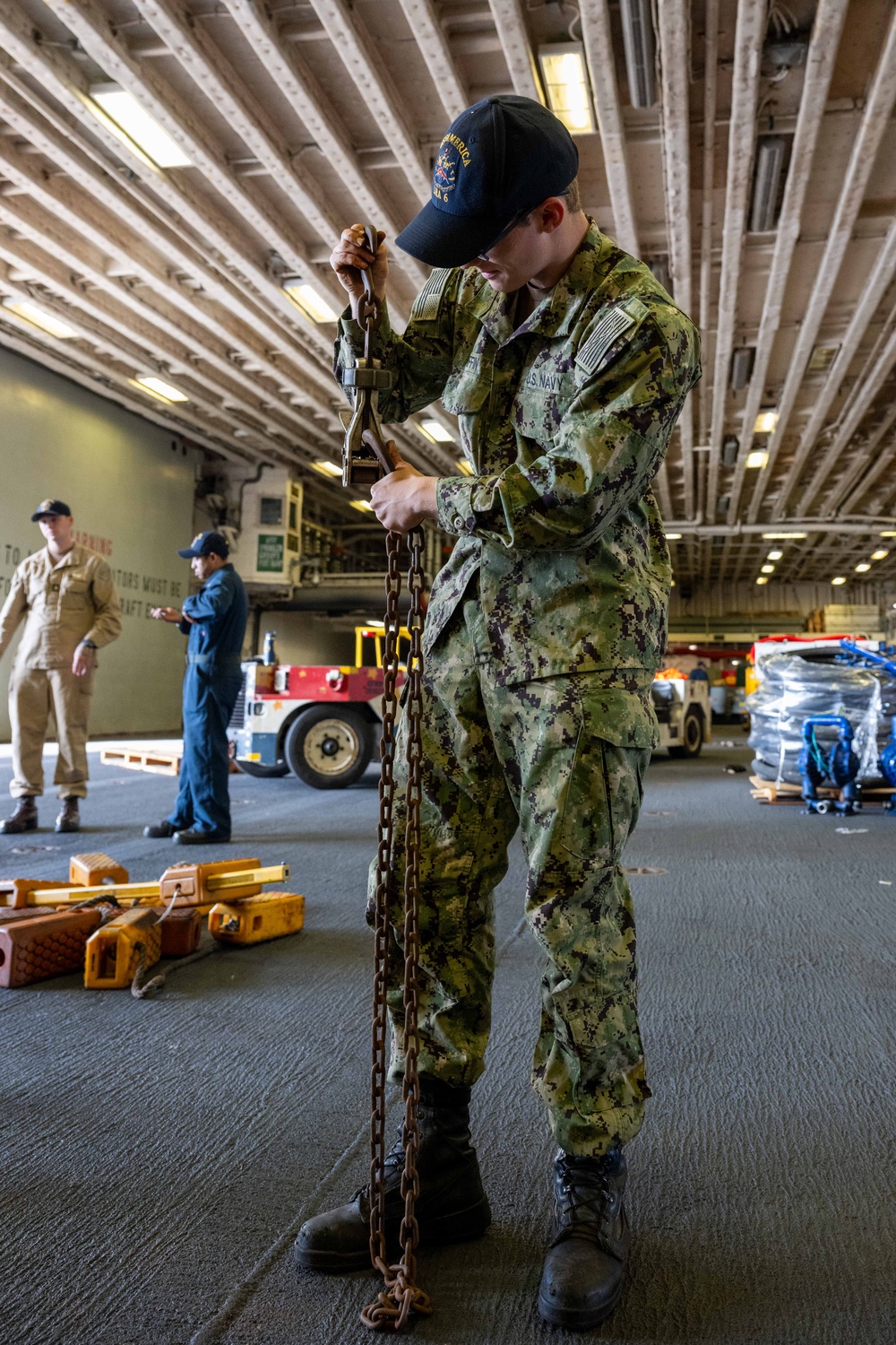 USS America (LHA 6) Conducts Stores Onload in the Hangar Bay