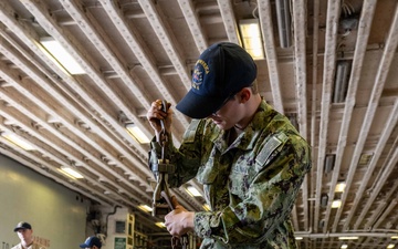 USS America (LHA 6) Conducts Stores Onload in the Hangar Bay