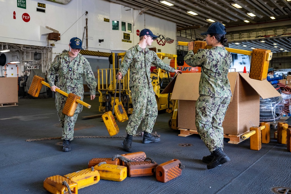 USS America (LHA 6) Conducts Stores Onload in the Hangar Bay