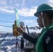 Sailors aboard the USS John Finn conduct a replenishment at sea with the USNS Rappahannock in the South China Sea