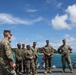 Sailors aboard the USS John Finn give a ship tour to Marines assigned to the 12th Littoral Combat Team and 3rd Marine Division in Okinawa, Japan
