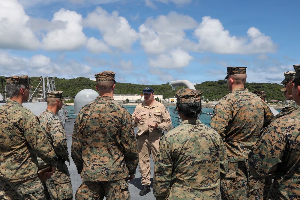 Sailors aboard the USS John Finn give a ship tour to Marines assigned to the 12th Littoral Combat Team and 3rd Marine Division in Okinawa, Japan