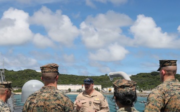 Sailors aboard the USS John Finn give a ship tour to Marines assigned to the 12th Littoral Combat Team and 3rd Marine Division in Okinawa, Japan