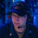 Sailors aboard the USS John Finn stand watch in the combat information center during Resolute Dragon 25 in the Philippine Sea