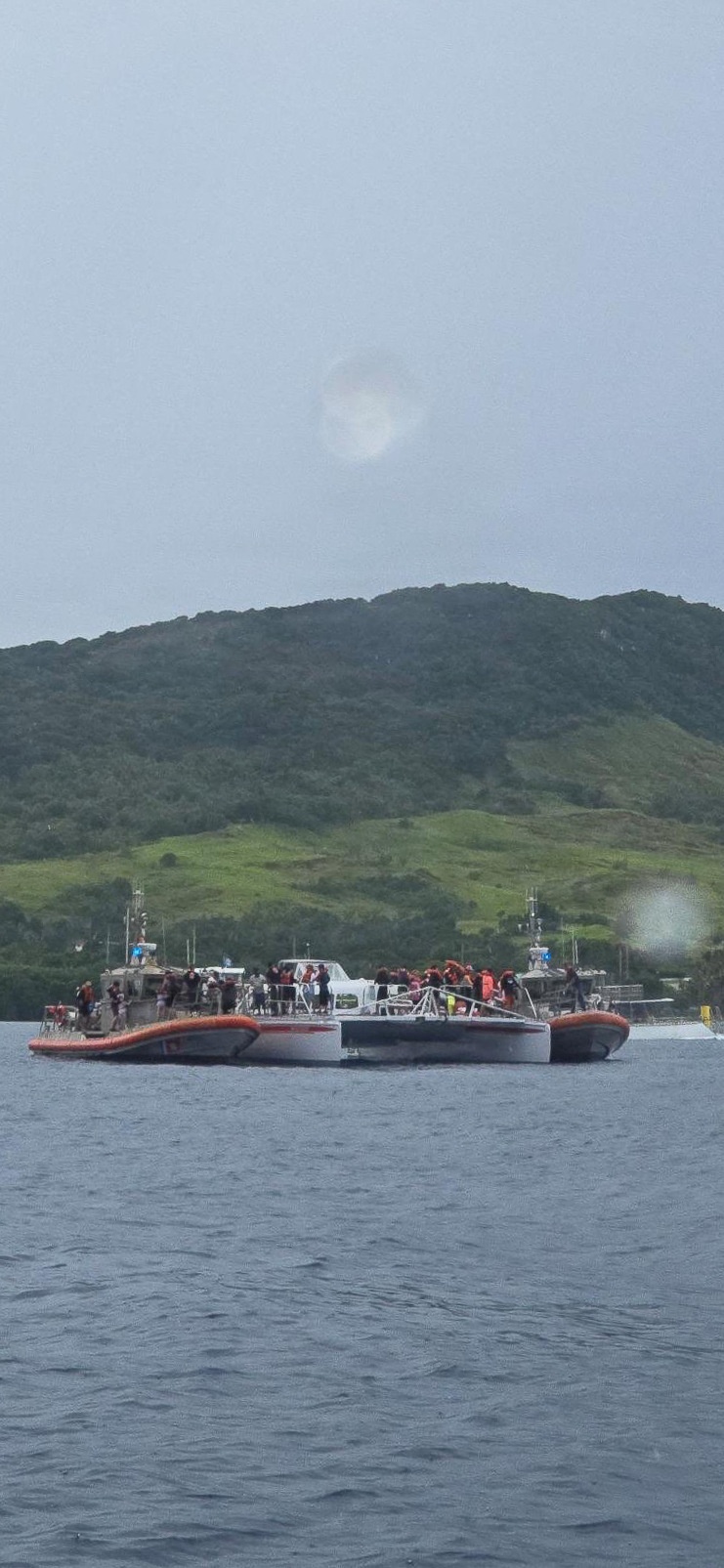 U.S. Coast Guard, Guam Fire Department rescue 45 people from boat off Agat, Guam