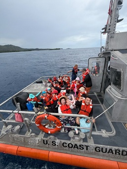 U.S. Coast Guard, Guam Fire Department rescue 45 people from boat off Agat, Guam
