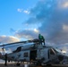 AEAN Bruce Wade and AE2 Paul Tran conduct post flight maintenance on an MH-60R Sea Hawk