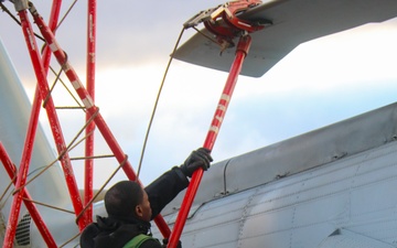 AMSA Jeremiah Cobb secures the final blade on an MH-60R Sea Hawk