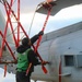 AMSA Jeremiah Cobb secures the final blade on an MH-60R Sea Hawk