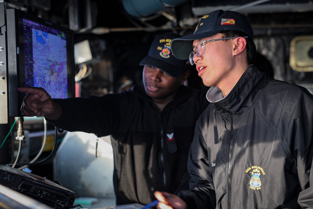QM2 Antonio Blackburn and ET3 Xian Zhang troubleshoot navigational display units in the pilot house