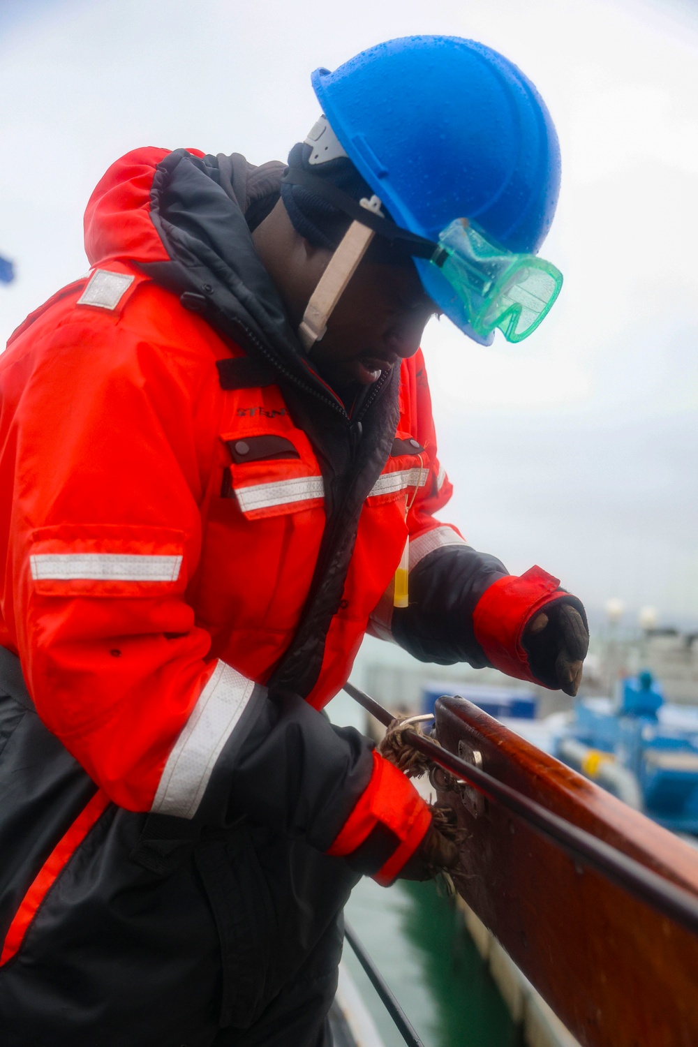 BMSN William Mwiseneza installs the ship name plaque to the lifeline