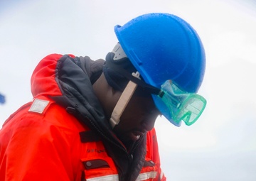 BMSN William Mwiseneza installs the ship name plaque to the lifeline